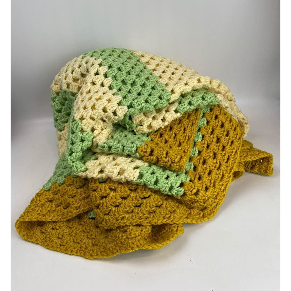 Handmade crocheted green cream and dark yellow blanket