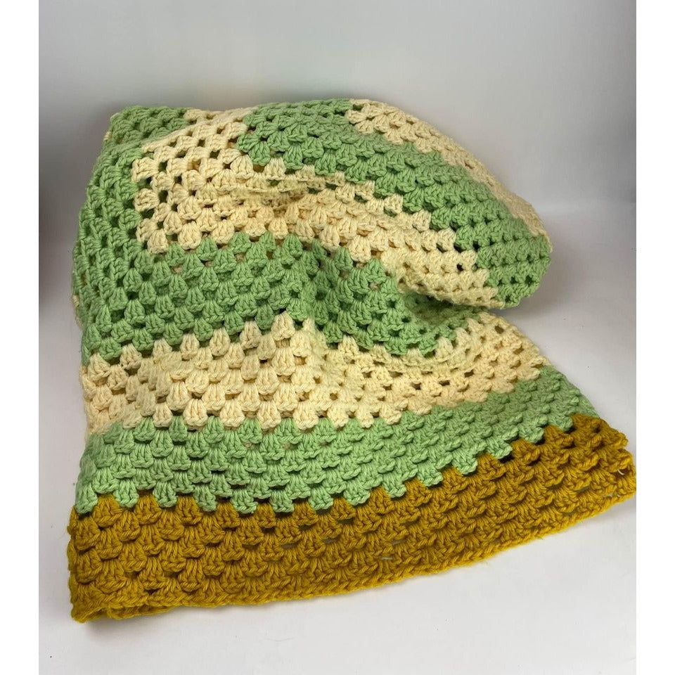 Handmade crocheted green cream and dark yellow blanket