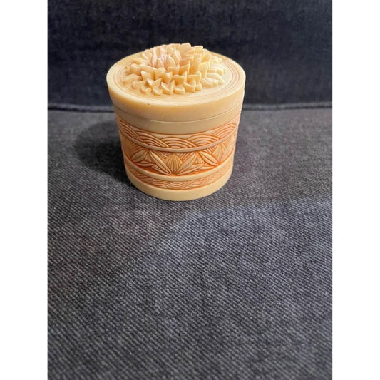 Small carved orange flower trinket box jar