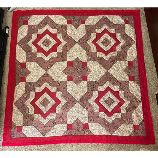 Red and white patchwork lap quilt